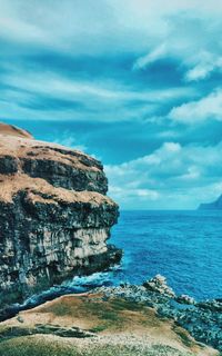 Scenic view of sea against blue sky