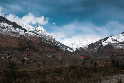 Scenic view of snowcapped mountains against sky