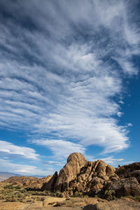 Rock formations on landscape against sky