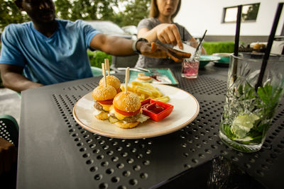 Midsection of man preparing food on table