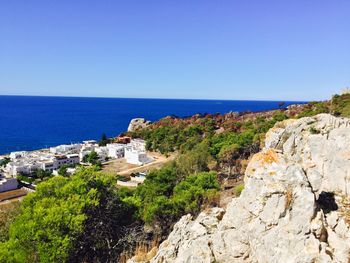 Scenic view of sea against clear blue sky