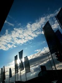 Low angle view of buildings against cloudy sky