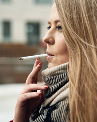 Close-up portrait of woman holding ice cream