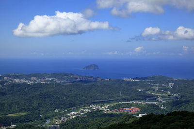 Scenic view of sea and mountains against sky