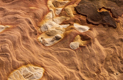 Full frame shot of rock on sand