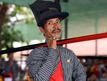 Portrait of man standing outdoors