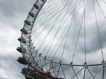 Low angle view of ferris wheel against sky