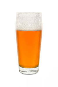 Close-up of beer glass against white background