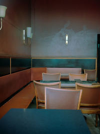 Empty chairs and table in restaurant