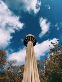 Low angle view of tower against cloudy sky