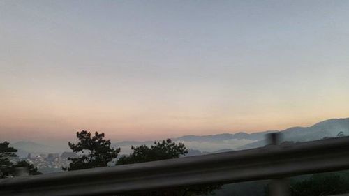 Scenic view of mountains against sky at sunset