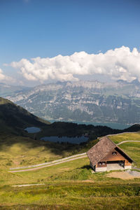 Scenic view of mountains against cloudy sky