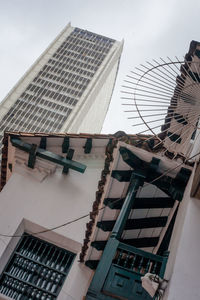 Low angle view of buildings in city against sky