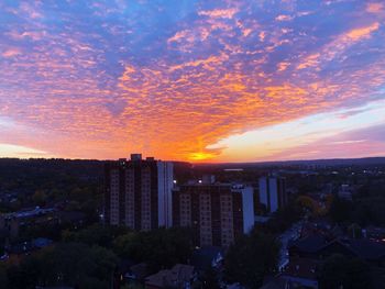 High angle view of buildings against dramatic sky