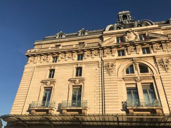 Low angle view of building against blue sky