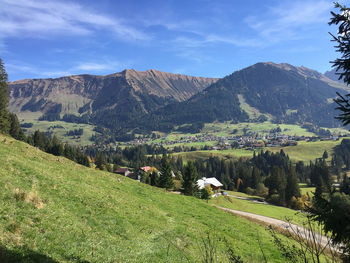 Scenic view of landscape and mountains against sky