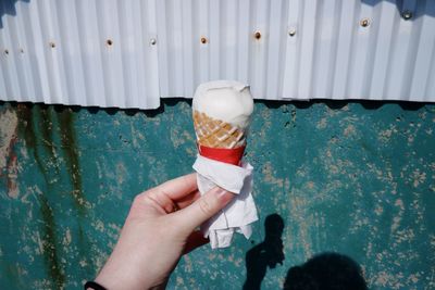 Midsection of person holding ice cream