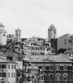 Buildings in city against sky