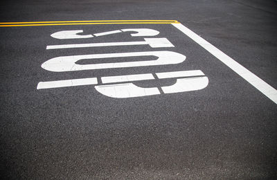 High angle view of arrow symbol on road