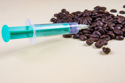 Close-up of coffee beans on table