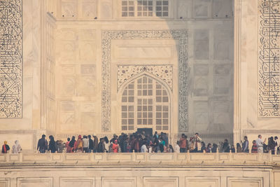 Close up taj mahal seen through a main door.