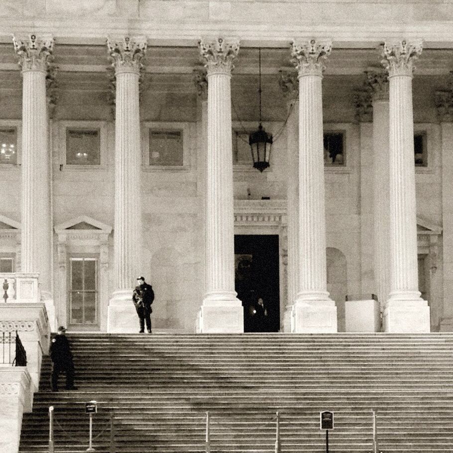 architecture, built structure, building exterior, architectural column, steps, low angle view, column, window, building, men, facade, statue, person, day, human representation, sculpture, outdoors, travel destinations, city