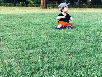 Full length of boy on field