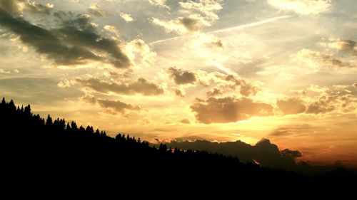 Scenic view of silhouette landscape against sky at sunset