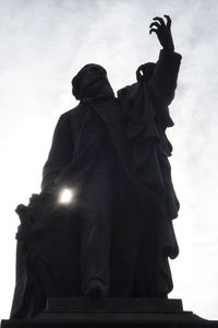 Low angle view of statue against sky