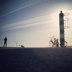 Woman cycling on road