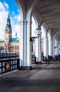 Empty corridor by river against hamburg town hall