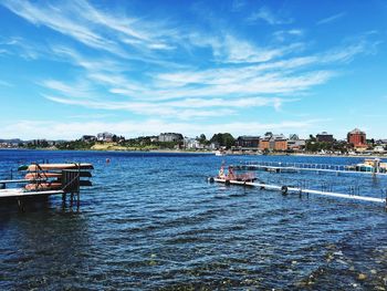 Boats moored at harbor
