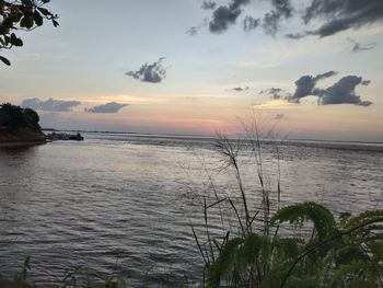 Scenic view of sea against sky at sunset