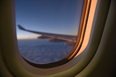 Close-up of sea seen through airplane window