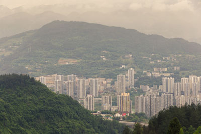 High angle view of buildings in city against sky