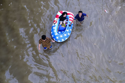 High angle view of people swimming in water