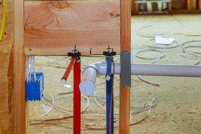 Close-up of clothes hanging on wooden door