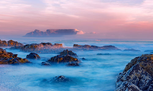 Scenic view of sea against sky at sunset