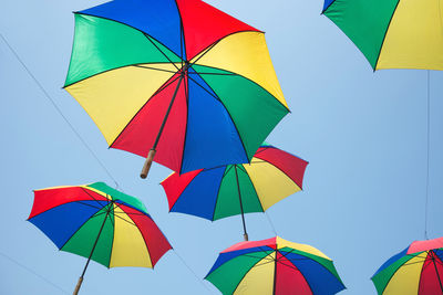 Low angle view of multi colored umbrellas