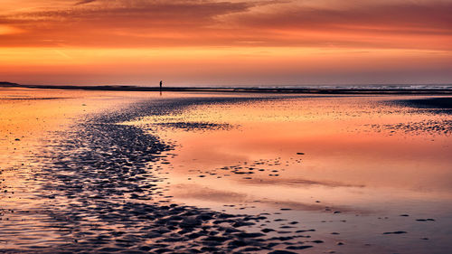 Scenic view of sea against dramatic sky