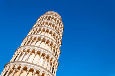 Low angle view of historical building against blue sky