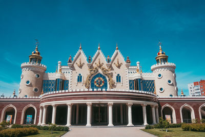 Low angle view of historical building against blue sky