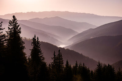 Scenic view of mountains against sky during sunrise