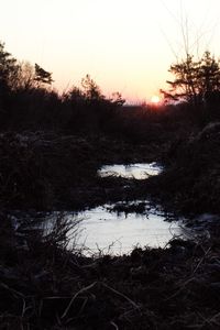 Scenic view of landscape against sky during winter