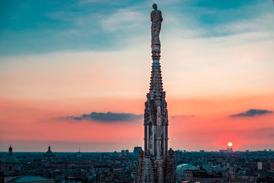 Romantic view at sunset from duomo rooftop milan city italy concept of travel in europe