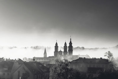 Buildings in city against sky