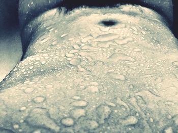 Close-up of water drops on woman