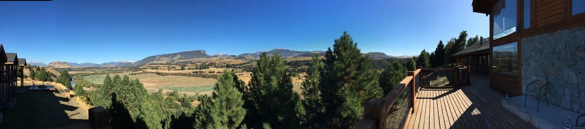 Panoramic shot of mountains against blue sky