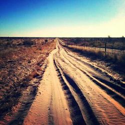 Empty road along landscape