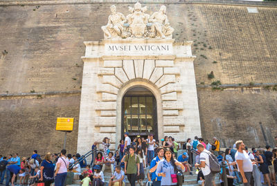 Group of people in front of historical building